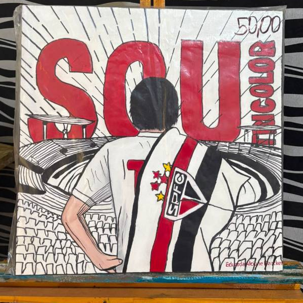 A pintura retrata um torcedor vestindo a camisa do São Paulo Futebol tamanho 40x40 cm
